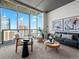Sunlit living room features modern decor, floor-to-ceiling windows, and comfortable seating at 891 14Th St # 3204, Denver, CO 80202