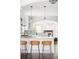 Bright kitchen featuring pendant lights and seating at the island at 8739 E 23Rd Ave, Denver, CO 80238