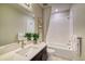New bathroom featuring a combined shower and bathtub plus a stylish vanity with a sink at 8795 Hugo Dr, Littleton, CO 80125