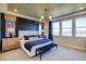 Bright bedroom boasts stunning views, a large bed, and contemporary furnishings at 8795 Hugo Dr, Littleton, CO 80125