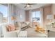 Bright bedroom with a rocking horse, floral wallpaper, and lots of natural light at 8795 Hugo Dr, Littleton, CO 80125