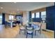 Dining area with a round wooden table set on a rug, with a view of the kitchen at 8795 Hugo Dr, Littleton, CO 80125