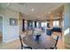 View of dining area into living room and kitchen, with a round wooden table set on a rug at 8795 Hugo Dr, Littleton, CO 80125
