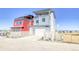Two-story home featuring modern design, a two car garage, and a covered balcony at 8795 Hugo Dr, Littleton, CO 80125