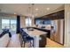 Modern kitchen featuring stainless steel appliances, pendant lighting, and a spacious island with barstool seating at 8795 Hugo Dr, Littleton, CO 80125