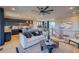 Open-concept living room with modern decor and adjoined kitchen at 8795 Hugo Dr, Littleton, CO 80125
