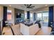 Bright living room with modern fireplace, open floorplan, and balcony access at 8795 Hugo Dr, Littleton, CO 80125