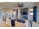Cozy living room with sleek fireplace, modern fan, and lots of natural light at 8795 Hugo Dr, Littleton, CO 80125
