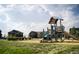Community playground and grassy area at 8795 Hugo Dr, Littleton, CO 80125