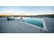 An outdoor community pool with lounge chairs, safety equipment, and easy access at 8795 Hugo Dr, Littleton, CO 80125