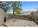 Wooden back deck with a privacy fence, perfect for outdoor relaxation and entertaining with a view of the neighborhood at 17151 E Stanford Ave # B, Aurora, CO 80015