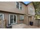 A cozy back patio and deck area with sliding glass doors, connecting indoor and outdoor living spaces at 17151 E Stanford Ave # B, Aurora, CO 80015