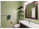 Modern bathroom features a vanity, decorative shelves, a mirror, and a glass-enclosed shower at 17151 E Stanford Ave # B, Aurora, CO 80015