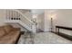 Living room with hardwood floors, a stair case, and natural lighting at 17151 E Stanford Ave # B, Aurora, CO 80015