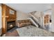 Open living area with fireplace, adjacent to stairs and the kitchen at 17151 E Stanford Ave # B, Aurora, CO 80015