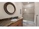 Bathroom with granite countertop vanity and a glass-enclosed shower at 4336 Chateau Ridge Rd, Castle Rock, CO 80108