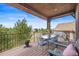 Outdoor deck with table seating, a grill, and mountain views at 4336 Chateau Ridge Rd, Castle Rock, CO 80108