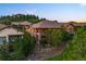 Rear exterior view of house showing a deck overlooking treed common area and neighborhood at 4336 Chateau Ridge Rd, Castle Rock, CO 80108