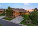 Charming single-Gathering home featuring a concrete driveway, an attached garage and mature trees at 4336 Chateau Ridge Rd, Castle Rock, CO 80108