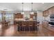 Open concept kitchen with large island, stainless steel appliances, and custom cabinetry at 4336 Chateau Ridge Rd, Castle Rock, CO 80108