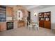 Charming wine cellar with stone archway, built-in cabinets, and tasting area at 4336 Chateau Ridge Rd, Castle Rock, CO 80108
