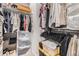Organized walk-in closet with shelving, hanging rods, and storage bins for optimal storage at 16179 W 70Th Pl, Arvada, CO 80007