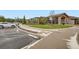 Modern community clubhouse featuring accessible entrance, well-kept grounds, and ample parking at 16179 W 70Th Pl, Arvada, CO 80007