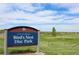 A sign for Bird's Nest Disc Park under a partly cloudy sky at 16179 W 70Th Pl, Arvada, CO 80007