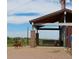 Dog park scene with a happy dog running near a covered bench with a mountain view at 16179 W 70Th Pl, Arvada, CO 80007