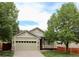 Charming single-Gathering home with a two-car garage and a cozy front porch at 16179 W 70Th Pl, Arvada, CO 80007