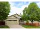 Charming single-Gathering home with a two-car garage and a cozy front porch at 16179 W 70Th Pl, Arvada, CO 80007