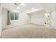 Finished basement with neutral carpet, can lights and access to bathroom at 1063 Roslyn Ct, Denver, CO 80230