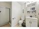Bathroom featuring glass shower and vanity at 1063 Roslyn Ct, Denver, CO 80230