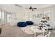 Upstairs playroom with carpet, two bean bags, teepee, table and chairs at 1063 Roslyn Ct, Denver, CO 80230