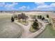 Breathtaking aerial view of the property, complete with a circular driveway and expansive acreage at 28800 E 168Th Ave, Brighton, CO 80603