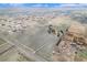 Expansive aerial view showcases a large property with surrounding neighborhood, open space, and farmland at 28800 E 168Th Ave, Brighton, CO 80603