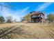 Beautiful backyard featuring mature trees, lush grass, and partial view of the home at 28800 E 168Th Ave, Brighton, CO 80603