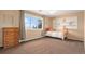 Comfortable bedroom with big window, closet, and carpet flooring at 28800 E 168Th Ave, Brighton, CO 80603