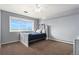 Bedroom features a big window offering views, neutral paint, and carpet flooring at 28800 E 168Th Ave, Brighton, CO 80603