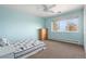 Freshly painted bedroom with big window, carpet flooring, closet and dresser at 28800 E 168Th Ave, Brighton, CO 80603