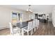 Bright dining room featuring a large table with seating for ten, wood floors and outdoor views at 28800 E 168Th Ave, Brighton, CO 80603