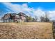 The house showcases Tudor architecture, and is surrounded by an expansive yard at 28800 E 168Th Ave, Brighton, CO 80603