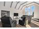 Open living room showcasing vaulted ceilings, ceiling fans, bright natural light, and comfortable seating at 28800 E 168Th Ave, Brighton, CO 80603