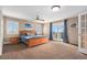 Large main bedroom with big window, ceiling fan, and private access to the backyard at 28800 E 168Th Ave, Brighton, CO 80603