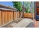 The back yard has a concrete patio and fresh mulch at 729 E 10Th Ave, Denver, CO 80203