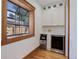 A charming bar area with an ice maker, wine fridge, and white cabinets at 729 E 10Th Ave, Denver, CO 80203
