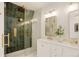 Beautiful bathroom featuring a luxurious shower with stylish tile and gold fixtures, creating a spa-like experience at 729 E 10Th Ave, Denver, CO 80203