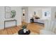 Bright bedroom featuring hardwood floors, contemporary art, and plenty of natural light from a large window at 729 E 10Th Ave, Denver, CO 80203