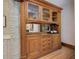 Classic wooden hutch with glass doors, drawers, and cabinet storage at 729 E 10Th Ave, Denver, CO 80203