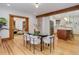 Open dining room features hardwood floors and an open concept design at 729 E 10Th Ave, Denver, CO 80203